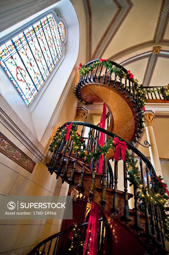 New Mexico, Santa Fe, Loretto Chapel, Spiral miraculous staircase to church balcony _ built between 1873 and 1878, Christmas decorations. Editorial Us...