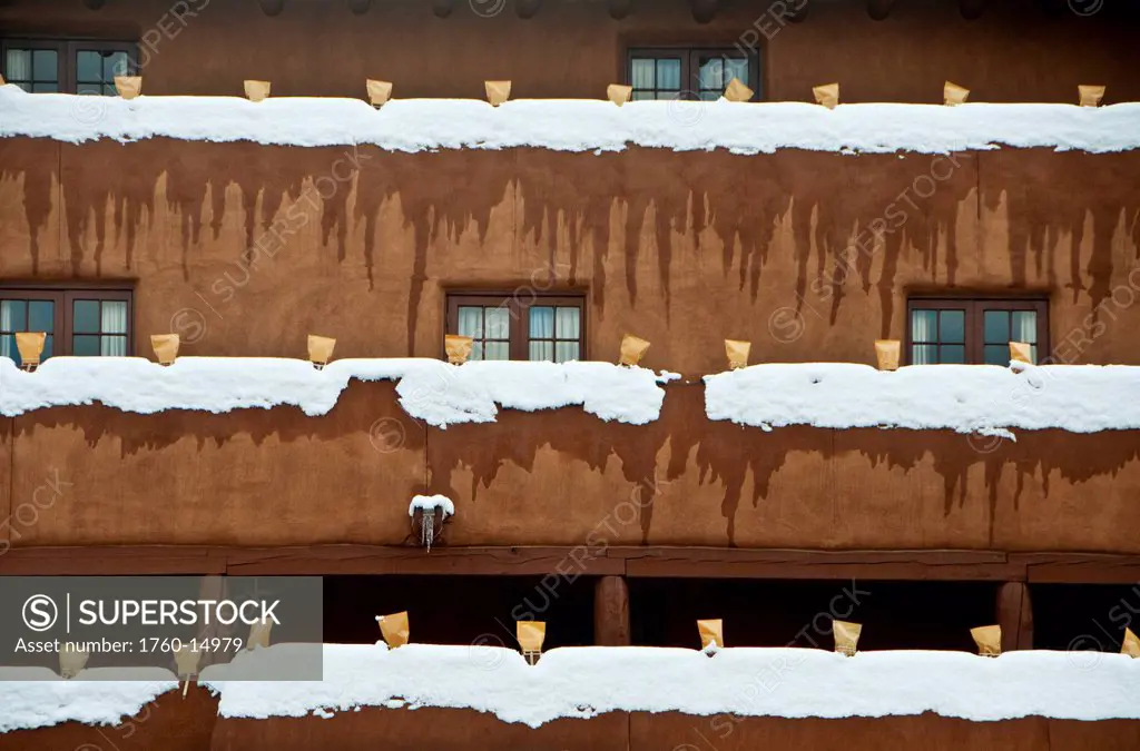 New Mexico, Santa Fe, Snow on ledges of Adobe building. Editorial Use Only.