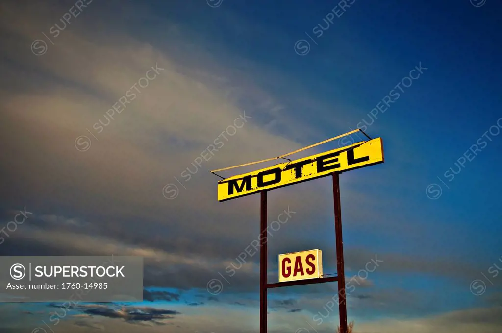 New Mexico, Old motel and gas sign against blue sky. Editorial Use Only.