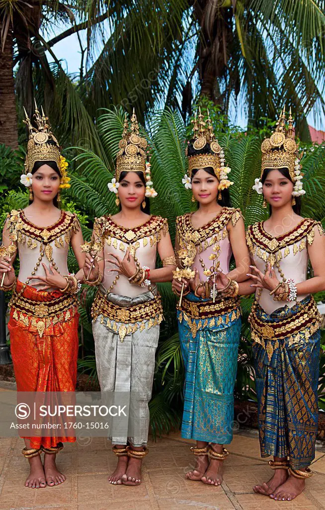 Cambodia, Siem Reap, Four young dancers wearing traditional costumes, posing.