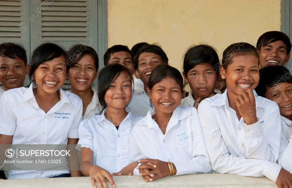 South East Asia, Cambodia, Siem Reap, A group of young school children gather for a class photo.