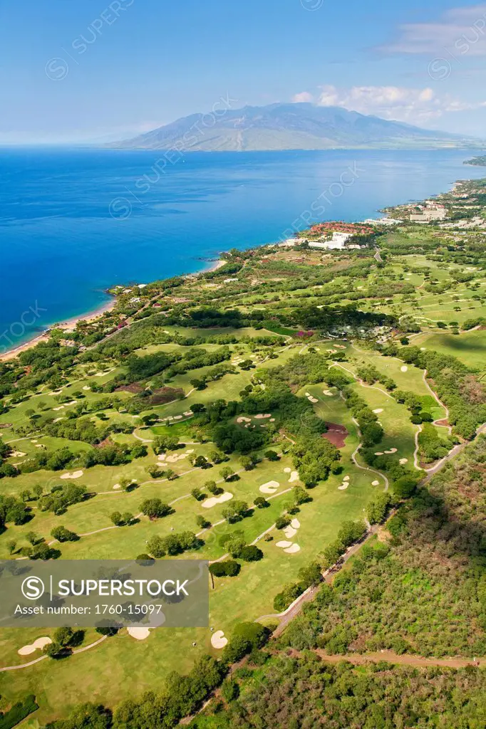 Hawaii, Maui, Aerial of Wailea golf courses, West Maui Mountains in the background.