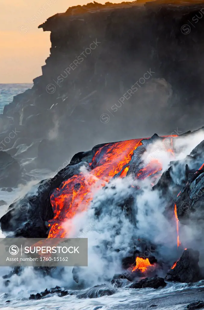 Hawaii, Big Island, Kalapana, Pahoehoe lava flowing from Kilauea reaching the Pacific Ocean.