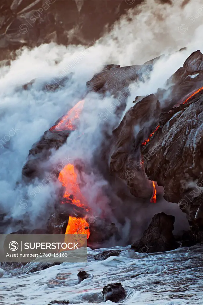 Hawaii, Big Island, Kalapana, Pahoehoe lava flowing from Kilauea reaching the Pacific Ocean.