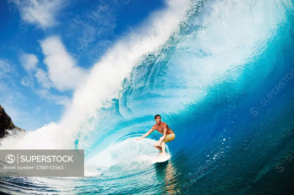 Hawaii, Maui, Kapalua, Professional surfer Albee Layer gets barreled on large wave. FOR EDITORIAL USE ONLY.