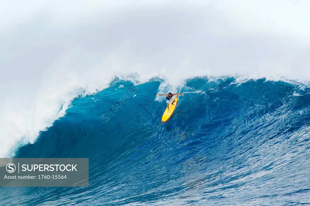 Hawaii, Maui, Peahi, Professional surfer Danilo Couto rides a wave at Peahi, also know as Jaws. FOR EDITORIAL USE ONLY.