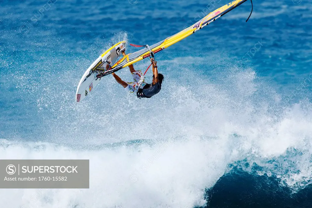 Hawaii, Maui, Ho´okipa, Windsurfer catches big air off wave. FOR EDITORIAL USE ONLY.