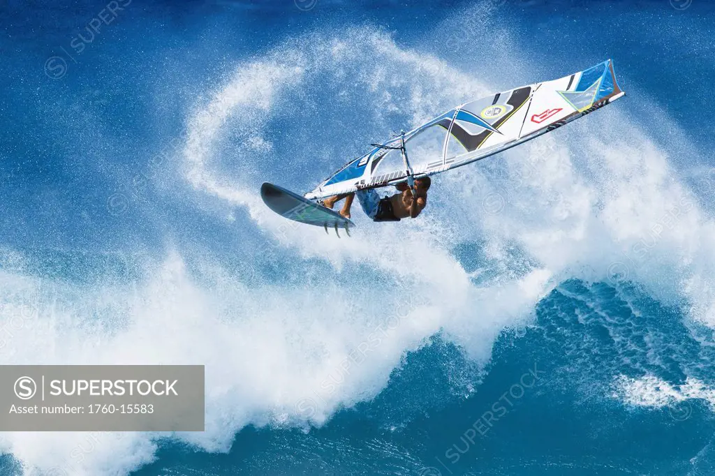 Hawaii, Maui, Ho´okipa, Professional windsurfer Marcilio Browne catches big air off wave. FOR EDITORIAL USE ONLY.