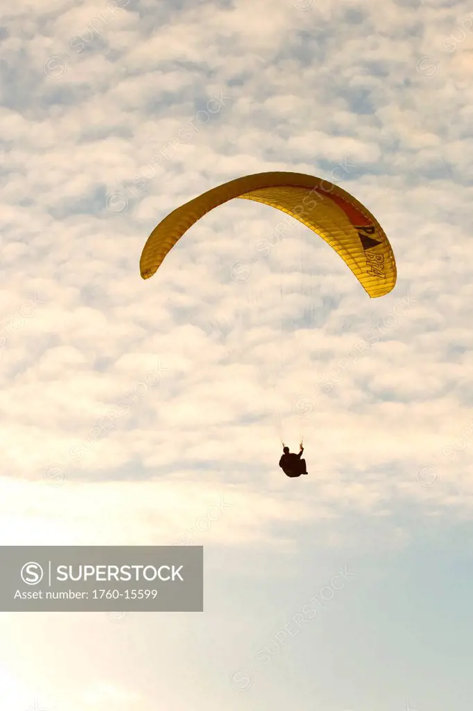 California, La Jolla, Paraglider flying near clouds. FOR EDITORIAL USE ONLY.
