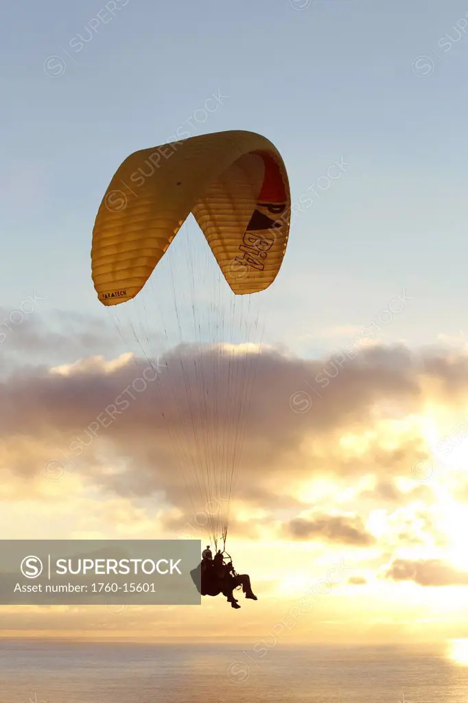 California, La Jolla, Paraglider flying near clouds. FOR EDITORIAL USE ONLY.