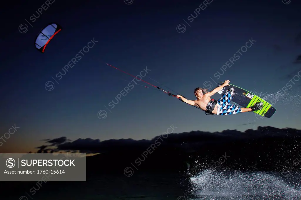 Hawaii, Maui, Professional kiteboarder Jesse Richman riding at Kitebeach at night. FOR EDITORIAL USE ONLY.