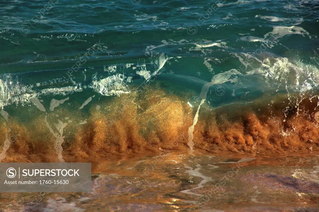 Hawaii, Small shore break, wave kicking up sand.
