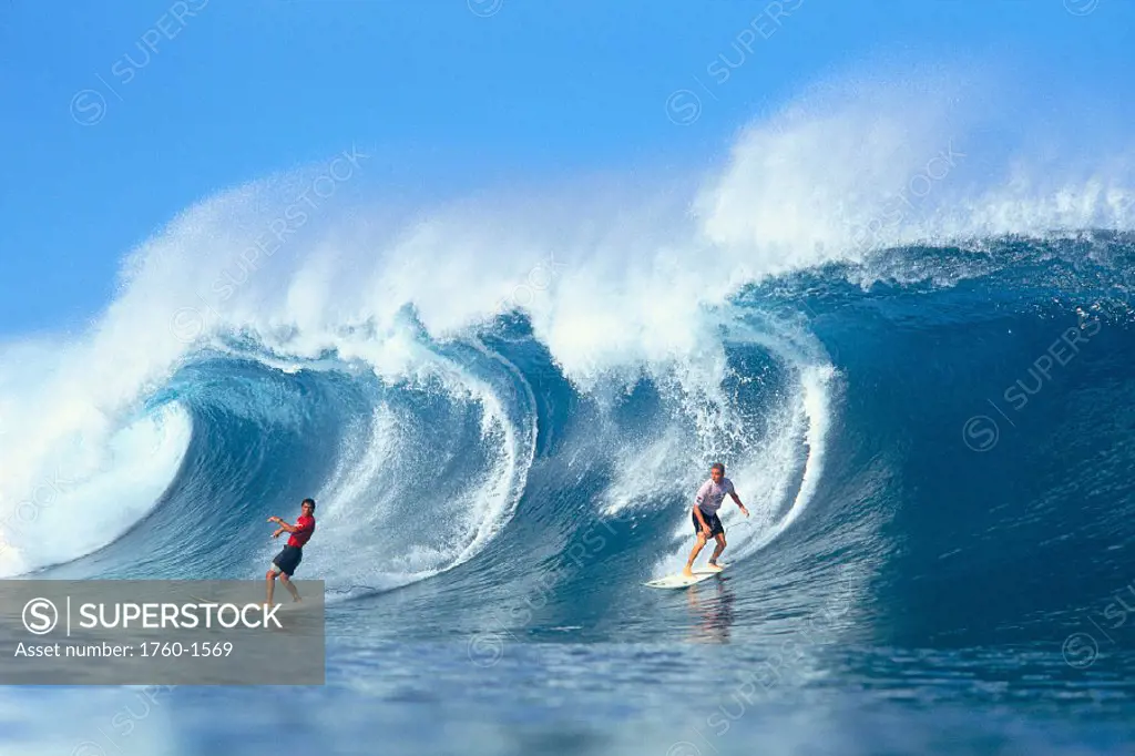 Hawaii, North Shore Oahu, Conan Hayes (right) two men riding large wave C1411 GR4740