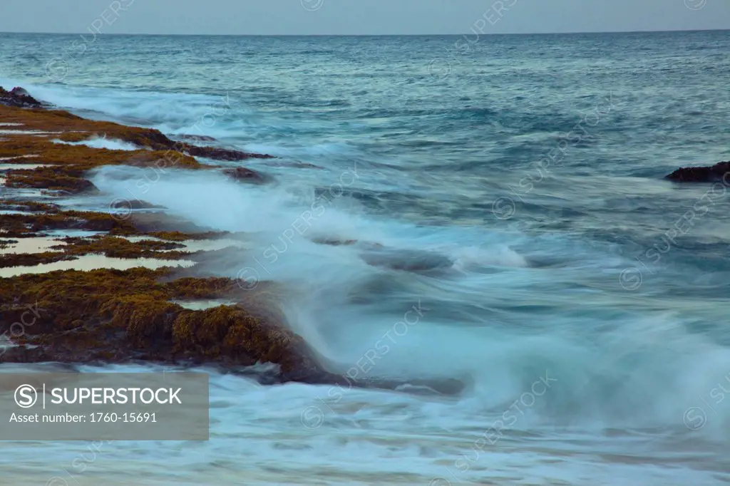 Hawaii, Ocean waves crash on a rocky coastline