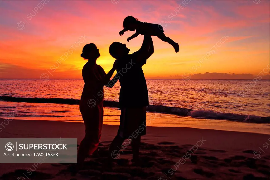 Silhouette of a family on the beach