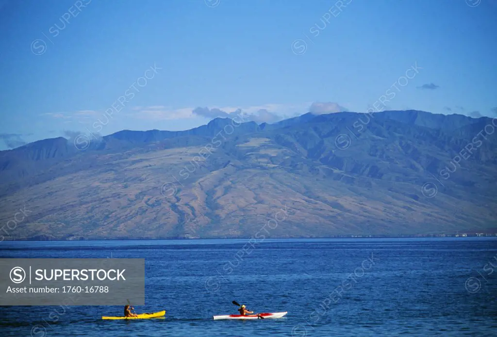 Hawaii, Maui, Wailea, Two kayakers paddling in the ocean.