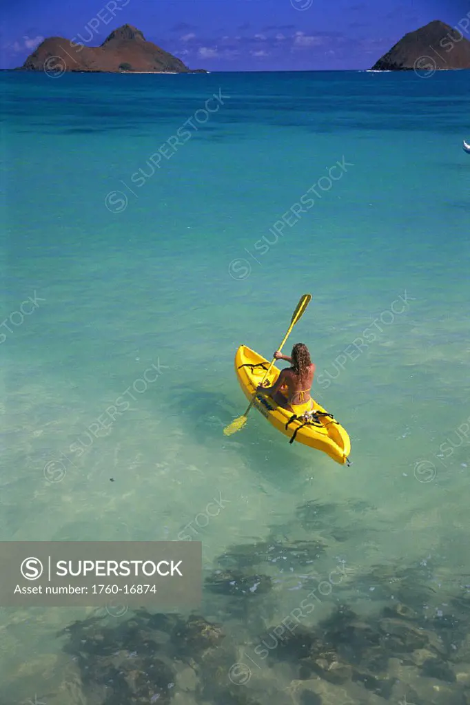 Lanikai view fr behind woman kayak to islands turquoise ocean D1253