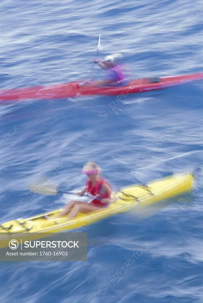 Blurred action two kayakers yellow & red closeup view from above D1213 Hawaii Maui