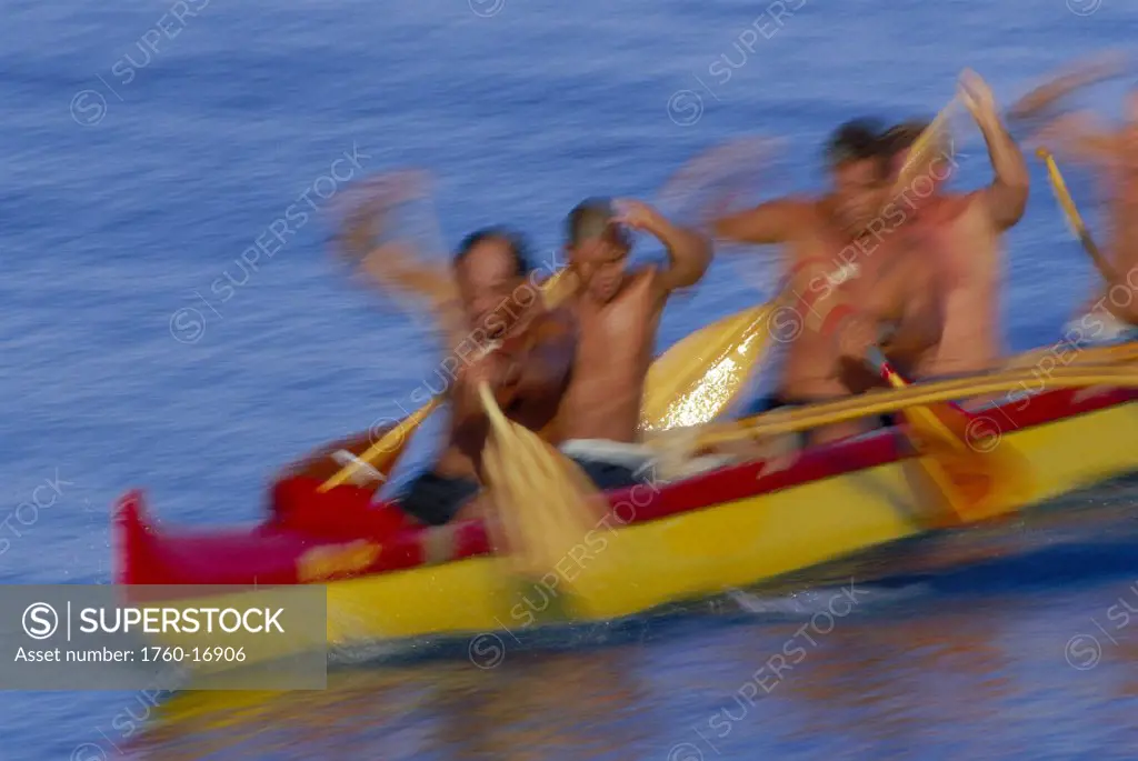 Closeup front angle men paddling outrigger canoe blur motion D1449