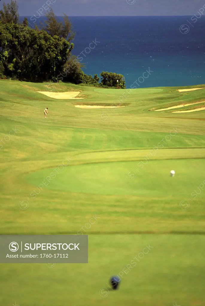 Hawaii, Kauai, Princeville Resort, Prince Golf Course, golfer on green, 6th hole, ocean view