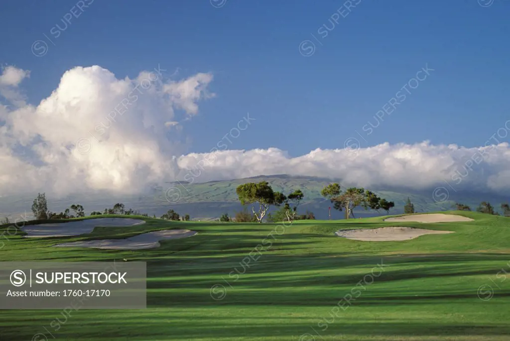 Hawaii, Big Island, Waikoloa Village Golf Course 5th hole with sand traps, shadows, blue sky