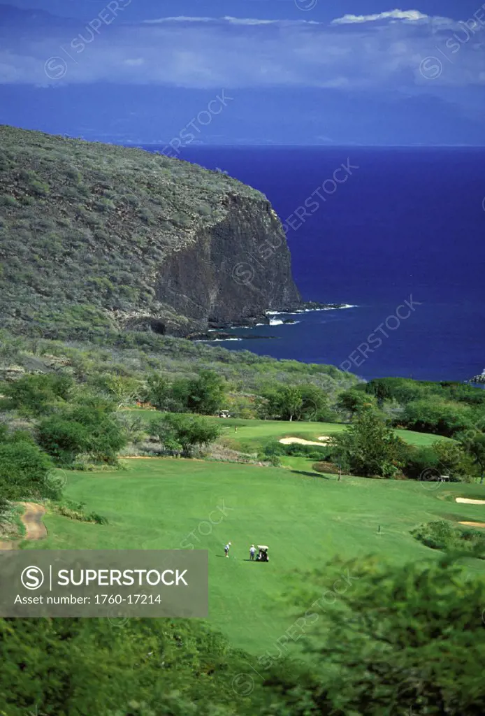 Hawaii, Lanai, The Challenge at Manele distant overview of golfers on course, ocean background