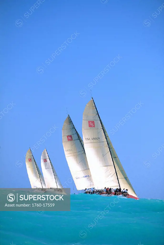 Miami, SORC, View from ocean water, four yachts in water swells, blue skies