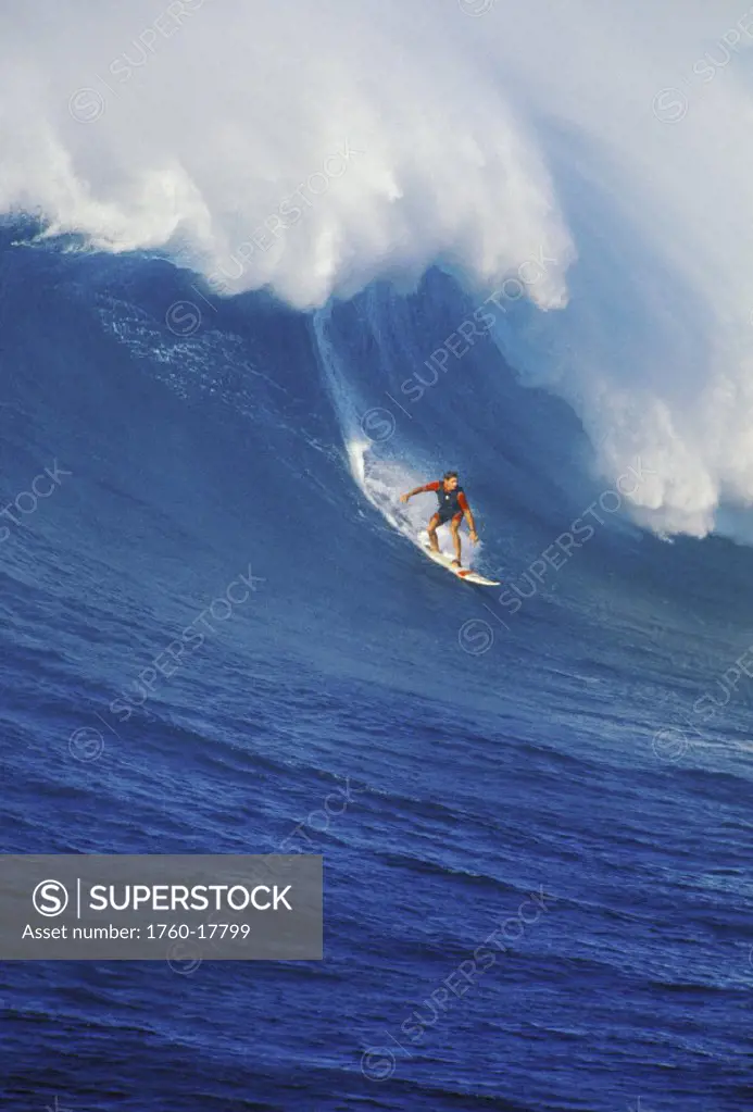 Hawaii, Maui, North Shore, Buzzy Kerbox surfs large curling wave, Jaws aka Peahi