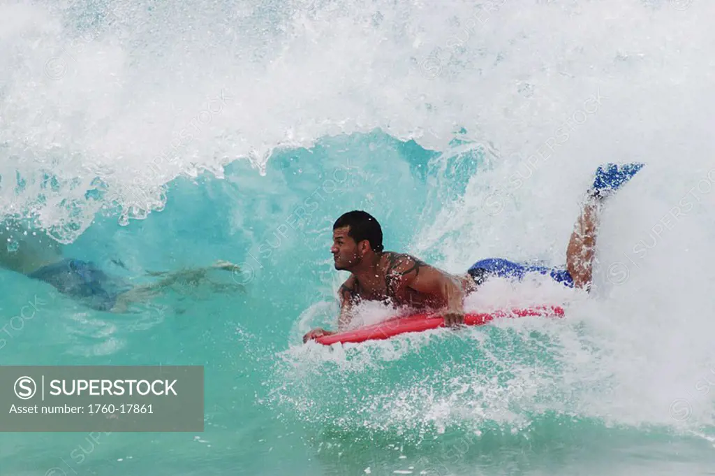 Hawaii, Oahu, Sandy Beach, Boogie Boarder rides a wave