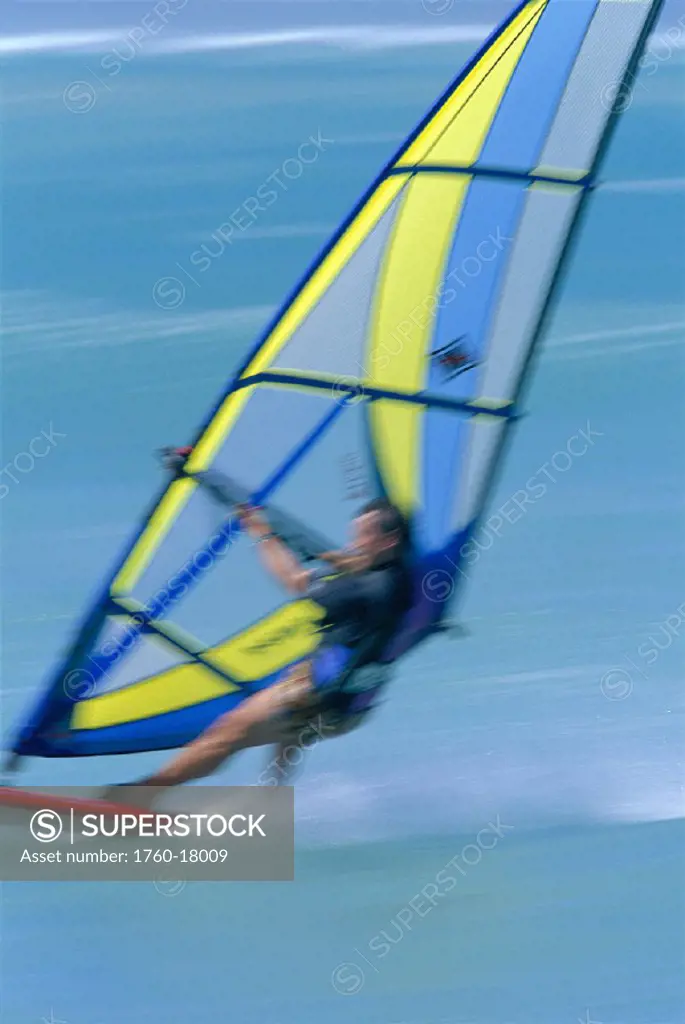 Hawaii Maui blurred action shot of man windsurfing view from behind D1225