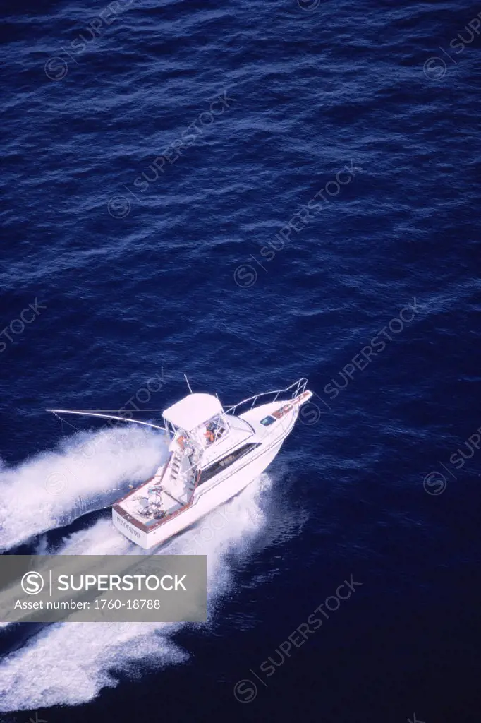 Aerial of new sport fishing boat, INNOVATOR, cutting through deep blue waters