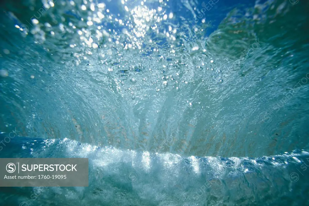 Hawaii, Sunlight glistening through a wave curl from Underwater.