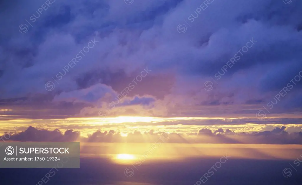 Hawaii, Sunset over ocean, Sunrays bursting through cumulous clouds