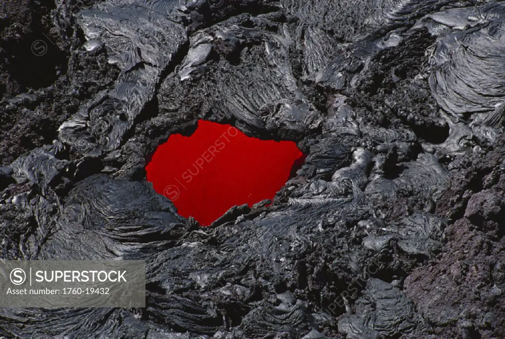 Hawaii, Big Island, Hawaii Volcanoes National Park, Molten lava seen through hole in lava tube.