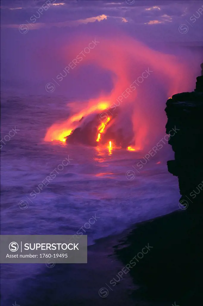 HI, BigIsle, Kilauea Volcano lava meets ocean action, glowing in pink steamy skies