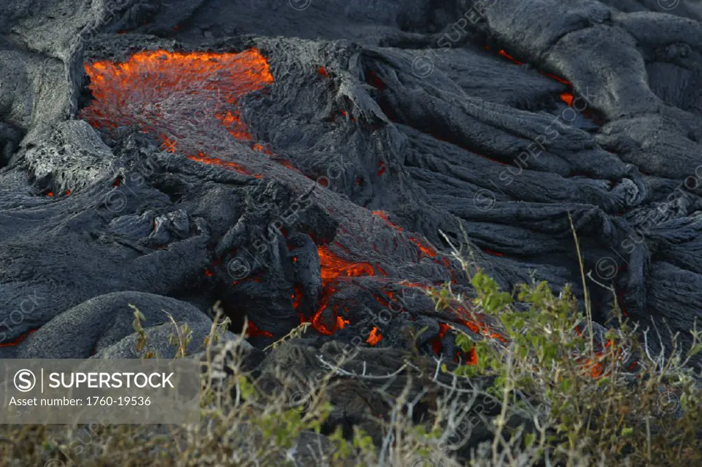 Hawaii, Big Island, Hawaii Volcanoes National Park, Pahoehoe lava, layered texture, glowing red.