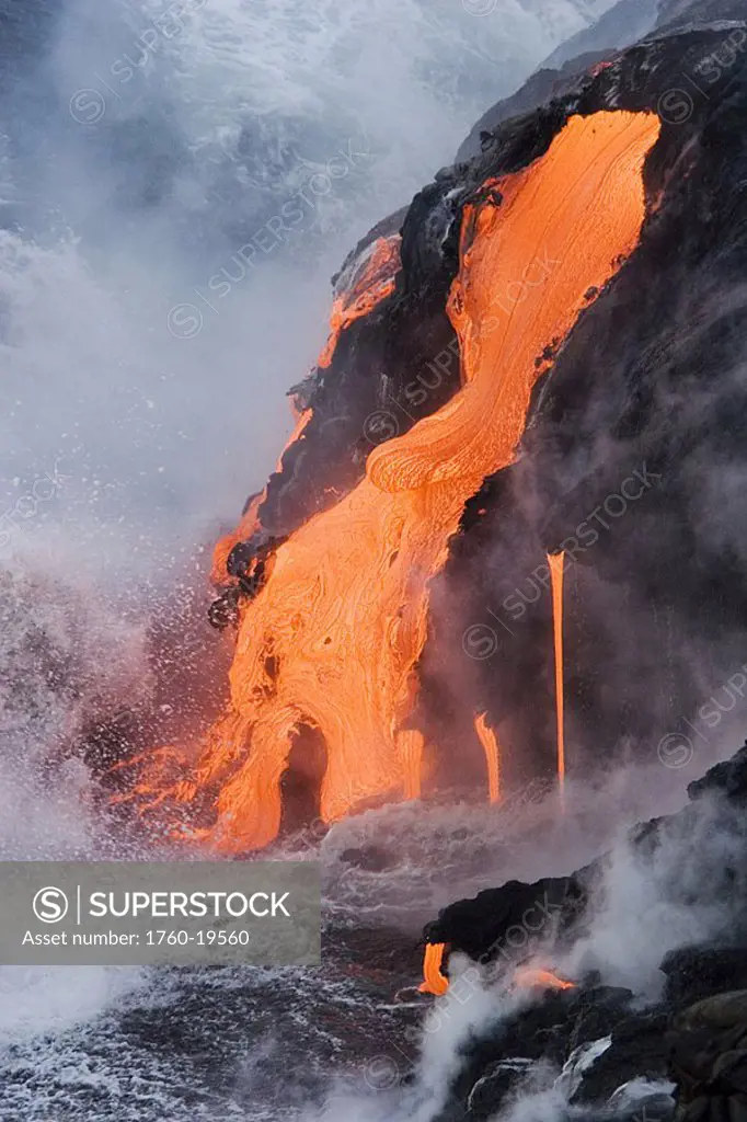 Hawaii, Big Island, near Kalapana, Pahoehoe lava flowing from Kilauea into Pacific Ocean, Seaspray and steam in air