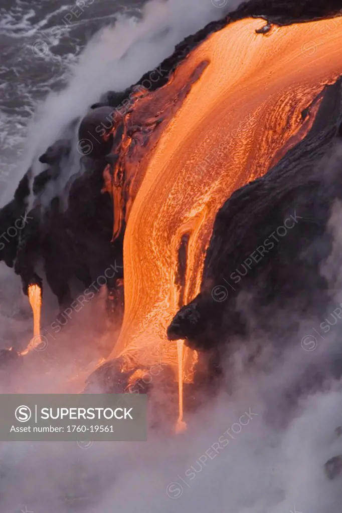 Hawaii, Big Island, near Kalapana, Close-up of pahoehoe lava flowing from Kilauea into Pacific Ocean