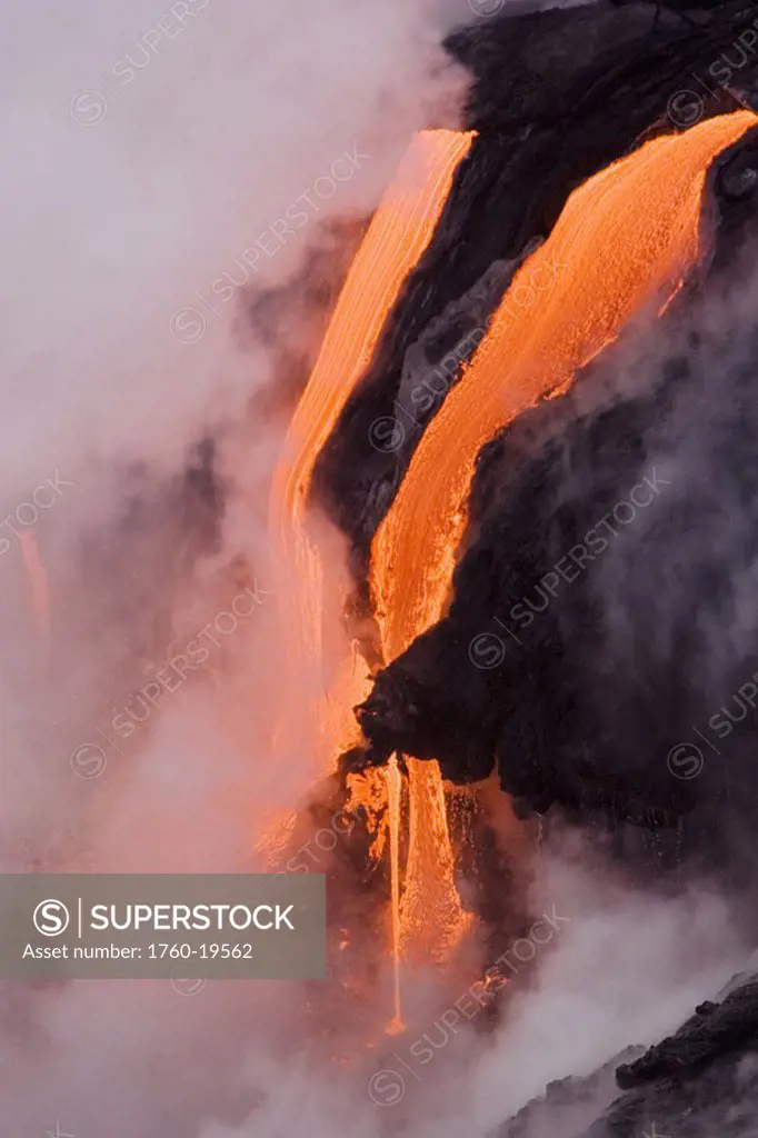 Hawaii, Big Island, near Kalapana, Close-up of pahoehoe lava flowing from Kilauea into steaming Pacific Ocean