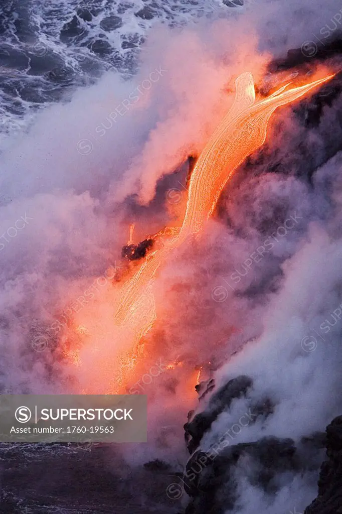 Hawaii, Big Island, near Kalapana, Pahoehoe lava flowing from Kilauea into steaming Pacific Ocean
