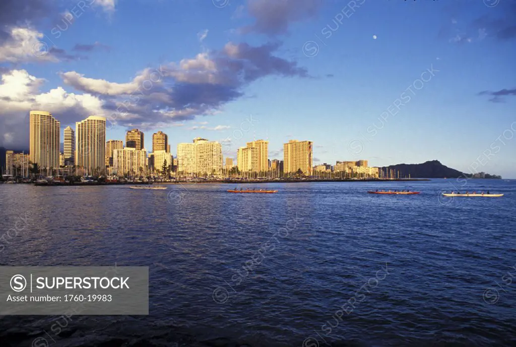 Hawaii, Oahu, View of Diamond Head and Waikiki from ocean with blue sky during afternoon