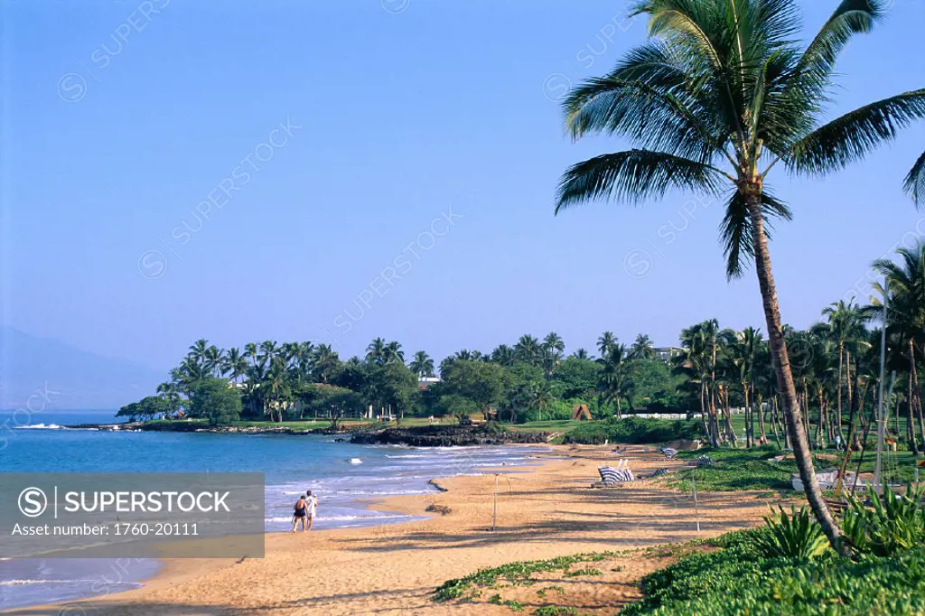 Hawaii, Maui, Wailea Beach w/ volleyball net & cabanas along shoreline, palm trees