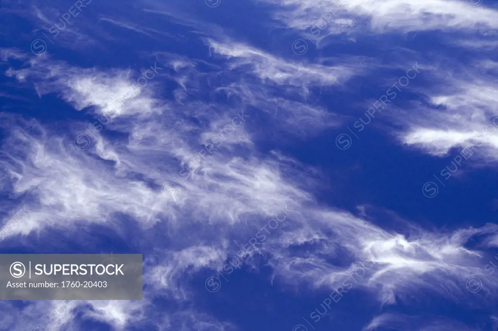 Blue sky background to array of wispy clouds in sky D1624