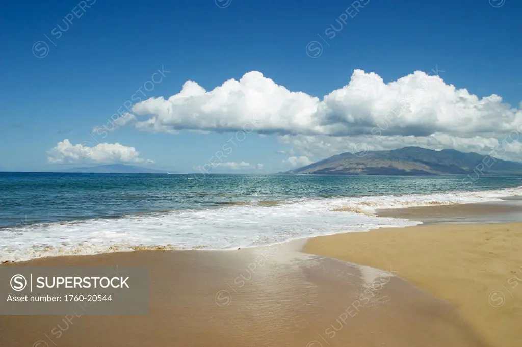 Hawaii, Maui, Kihei, ocean and sand, West Maui mountains in the distance.