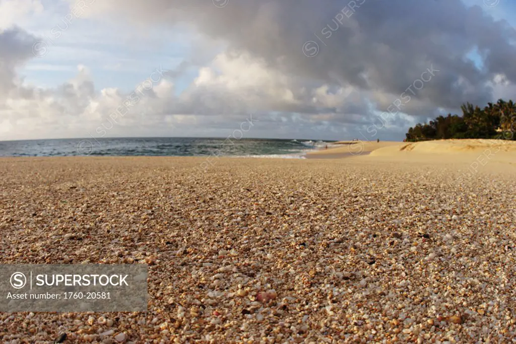 Hawaii, Oahu, North Shore, textured sand, ocean and sky.