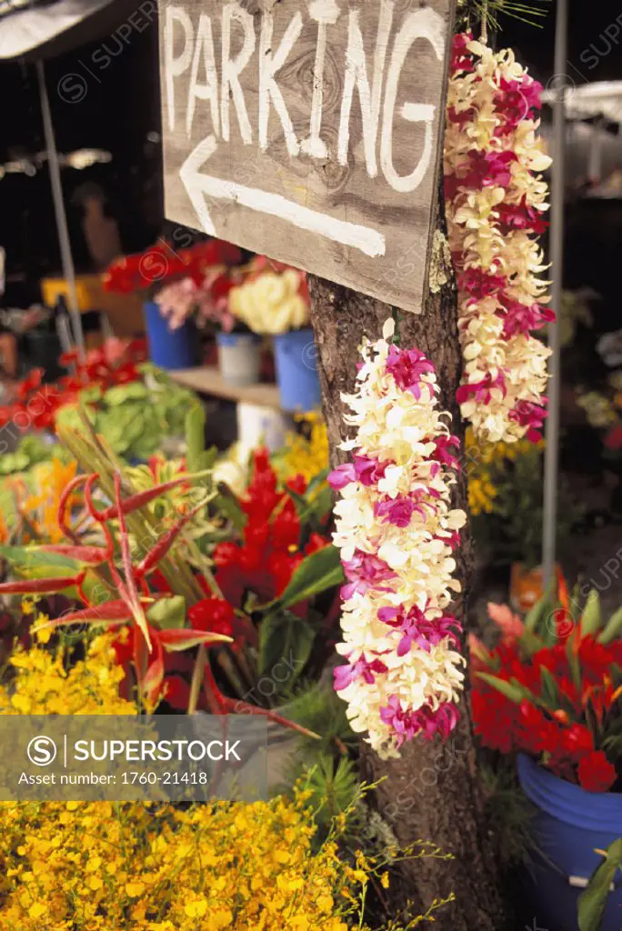 Hawaii, Big Island, Hilo, Lei and flower stand with parking sign