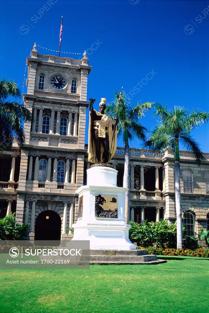 Hawaii, Oahu, view of King Kamehameha statue, green grass, blue sky
