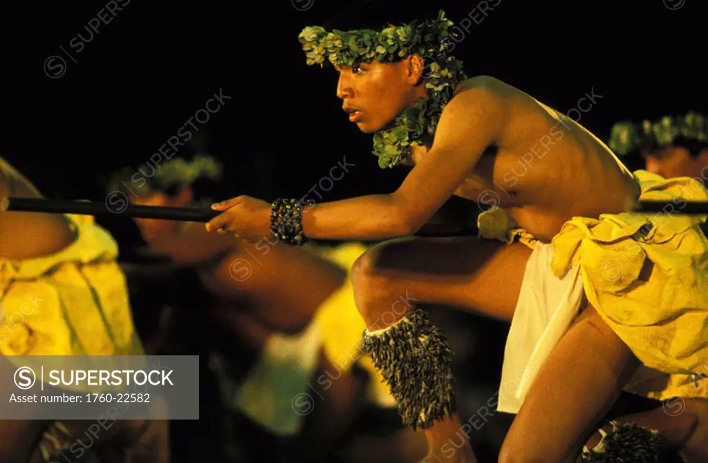 Hawaii, Big Island, Merrie Monarch Hula Festival, Kane Kahiko dancers, view from side.