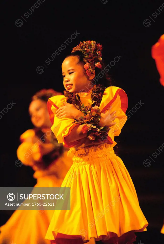 Hawaii, Keiki hula, girls on stage wearing yellow dress, kupe´e, dark background