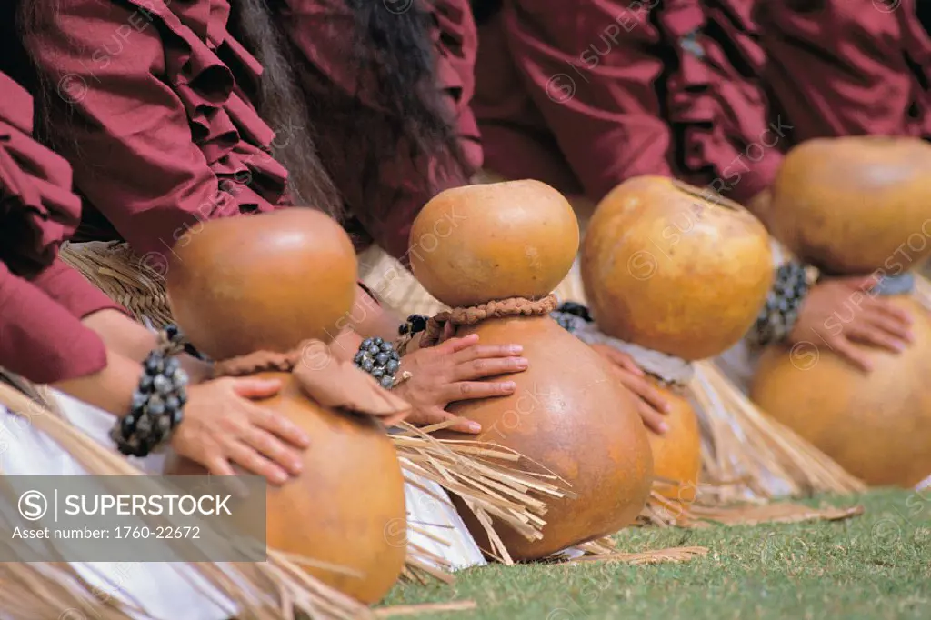 Kamokila Campbell hula festival, Closeup of womens hands on ipu (gourd) all sit on grass